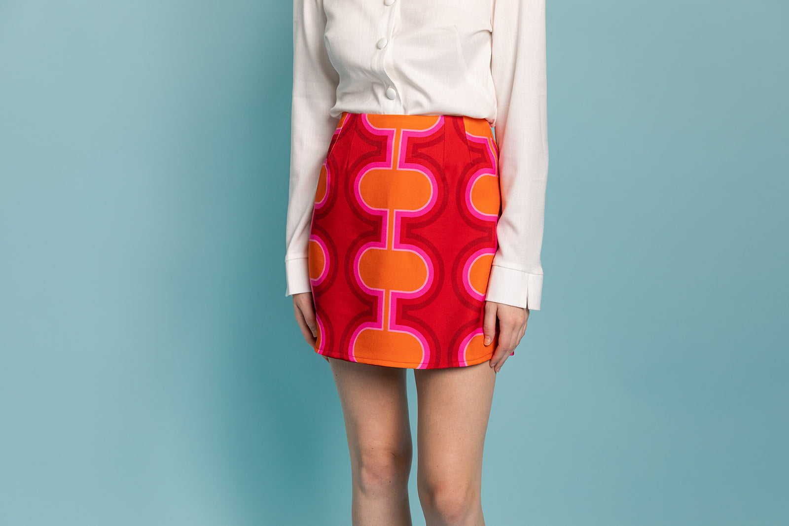 Closet Mod high waist a-line mini skirt in red, pink and orange retro 1960's print